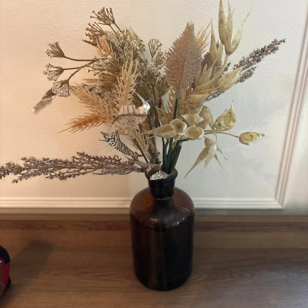 Brown glass vase with fake dried flowers Glass is 7
